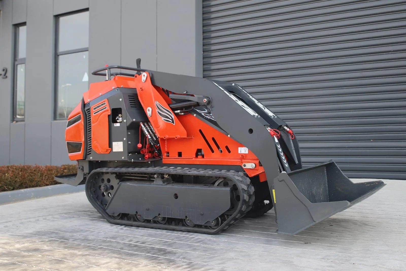 C1200 compact tracked loader side view with standard bucket