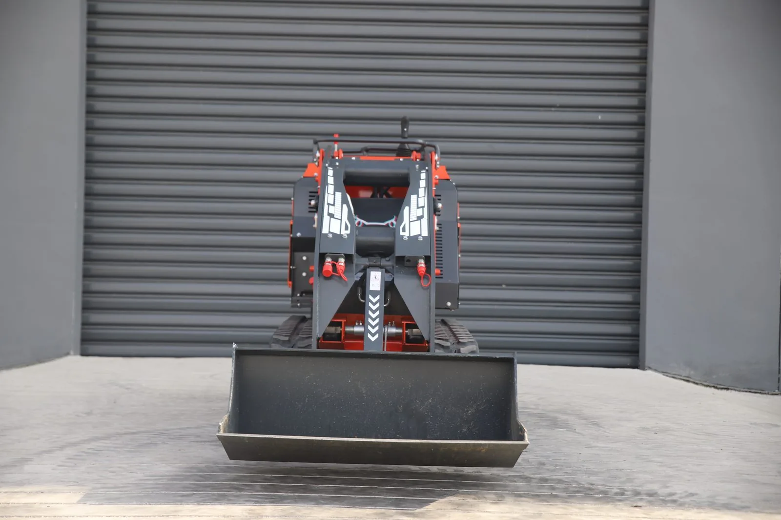 C1200 narrow job site loader front bucket view