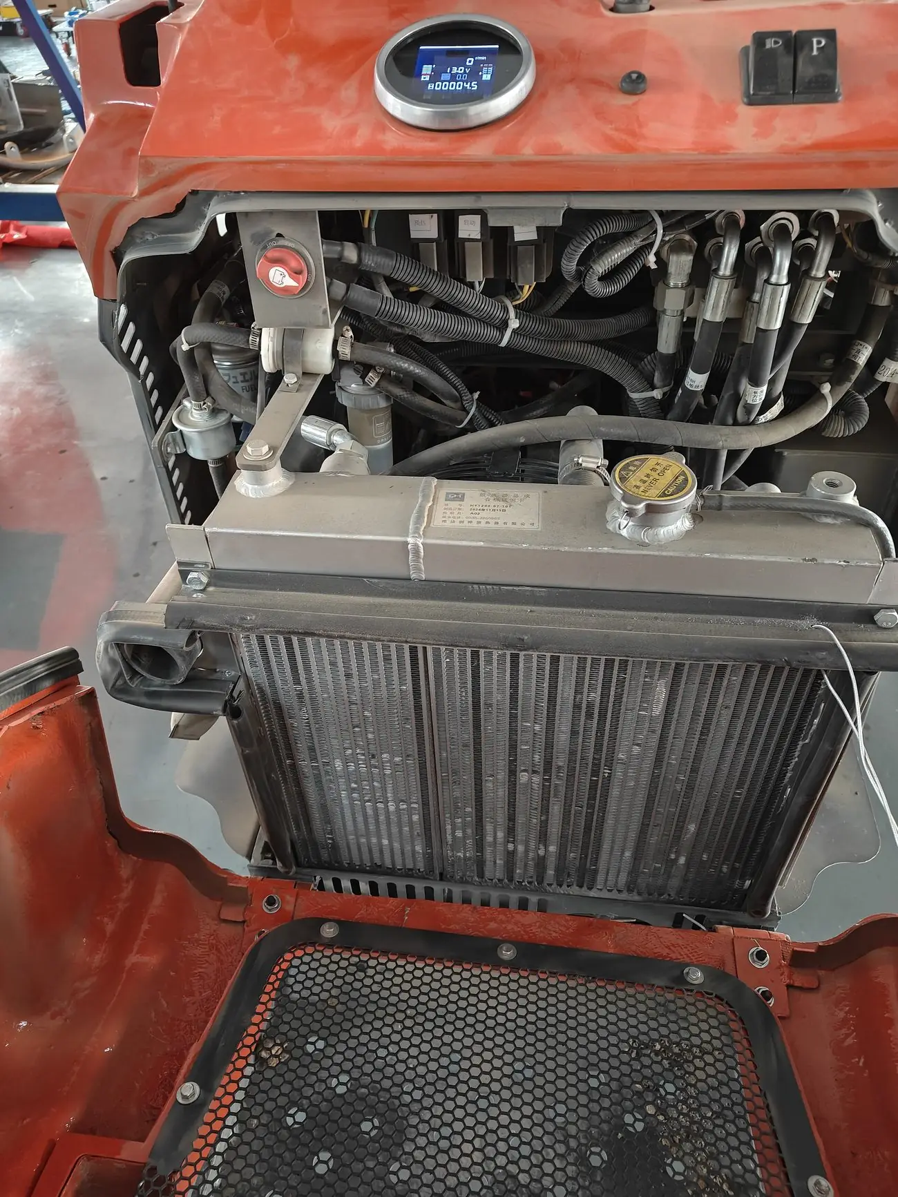 C1200 open service compartment with cooling system access
