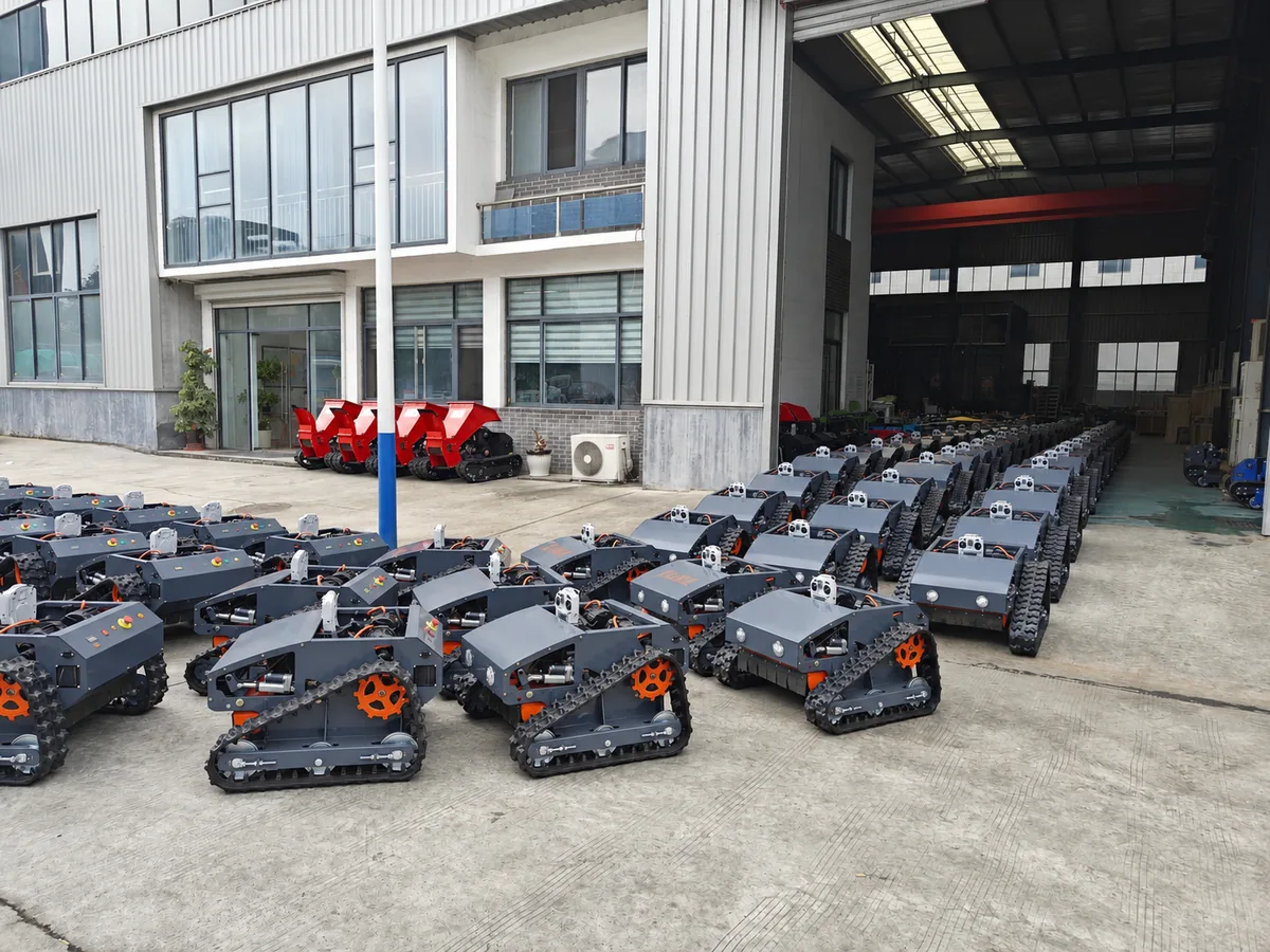 Remote control lawn mowers ready for overseas delivery outside the workshop