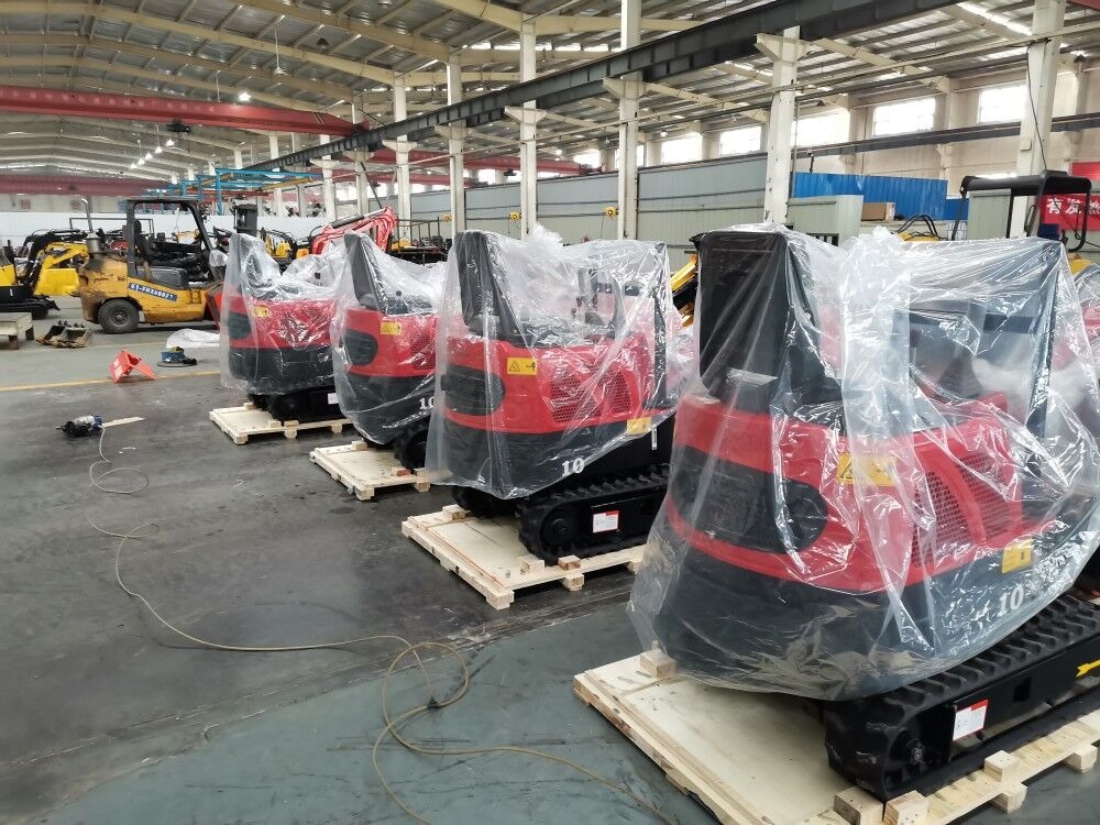 Compact mini excavators protected and arranged for export packing