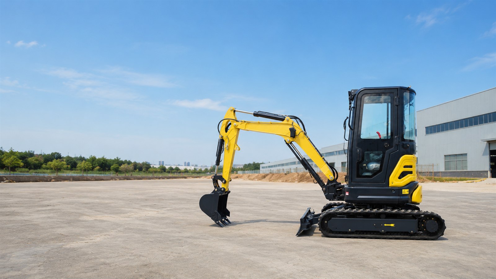 KORVA GW30 yellow cabin compact excavator outside an industrial facility