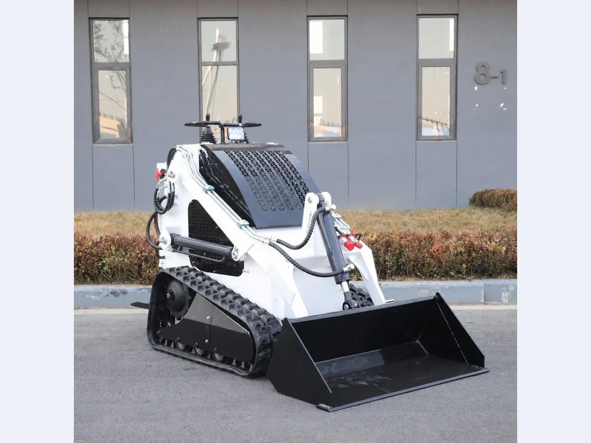 White customized KORVA T360 tracked mini skid steer loader for property maintenance