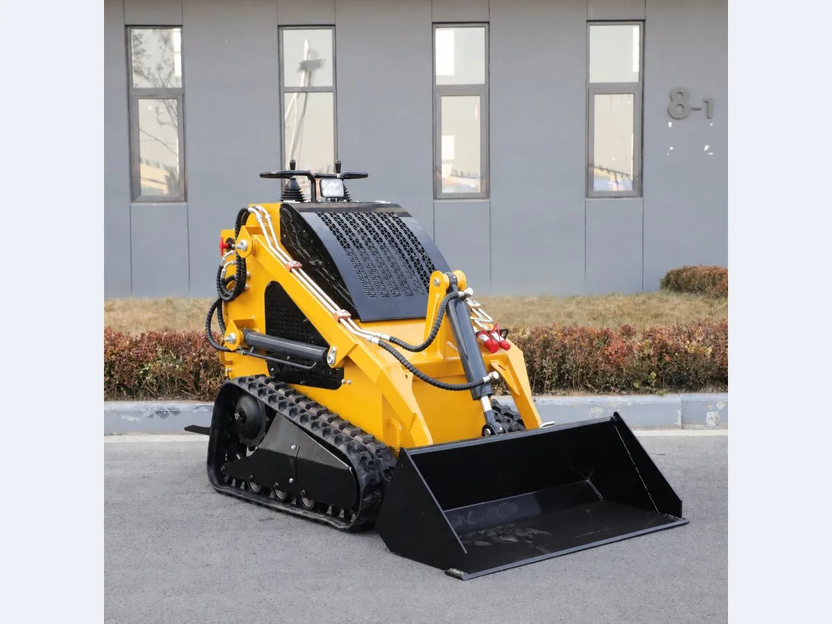 Yellow customized KORVA T360 tracked mini skid steer loader for landscaping work
