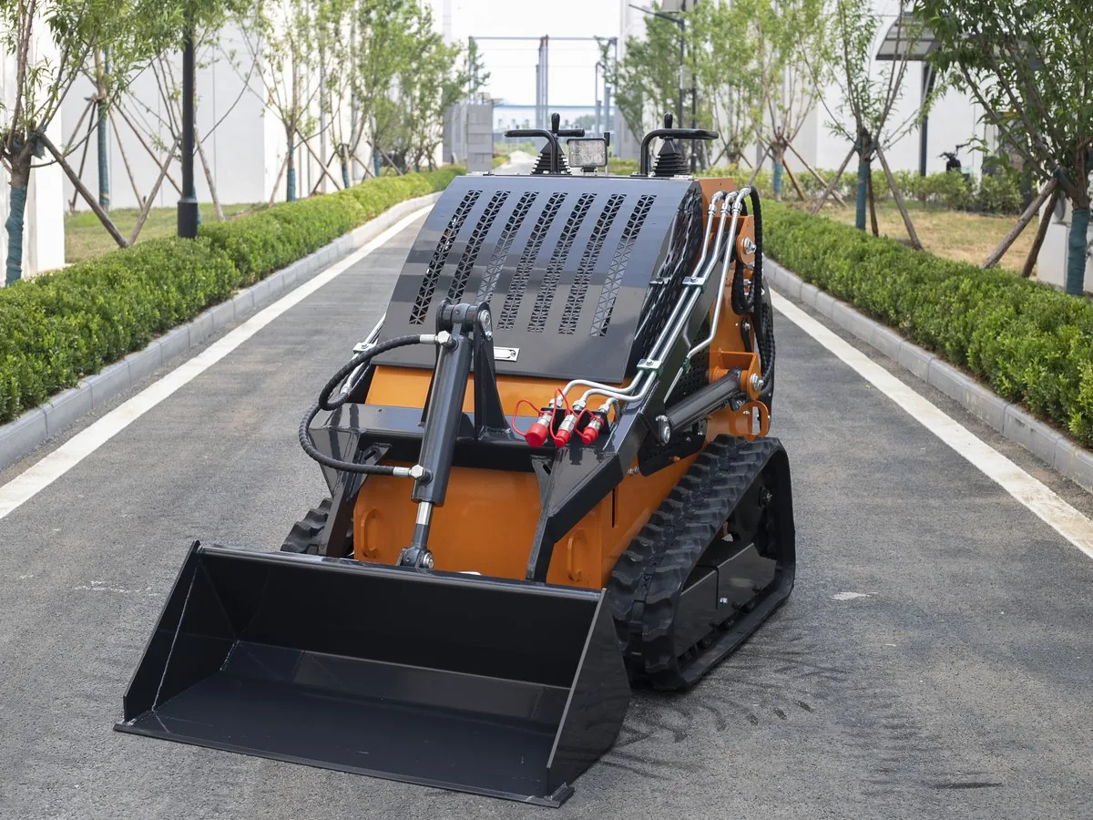 KORVA T460 tracked mini skid steer loader front angle with general purpose bucket