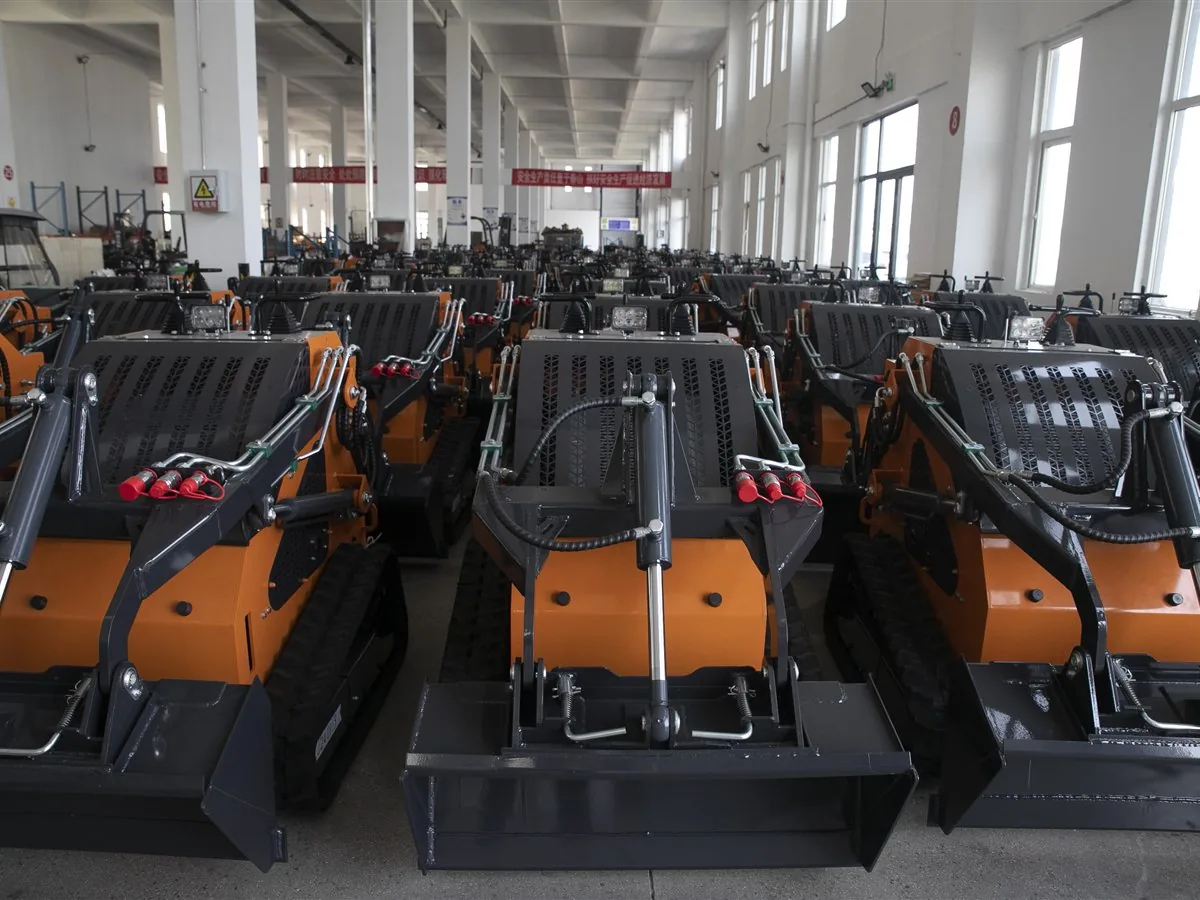 Finished T750 compact mini skid steer loaders staged in the workshop